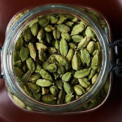 High-quality cardamom stored in a transparent glass jar